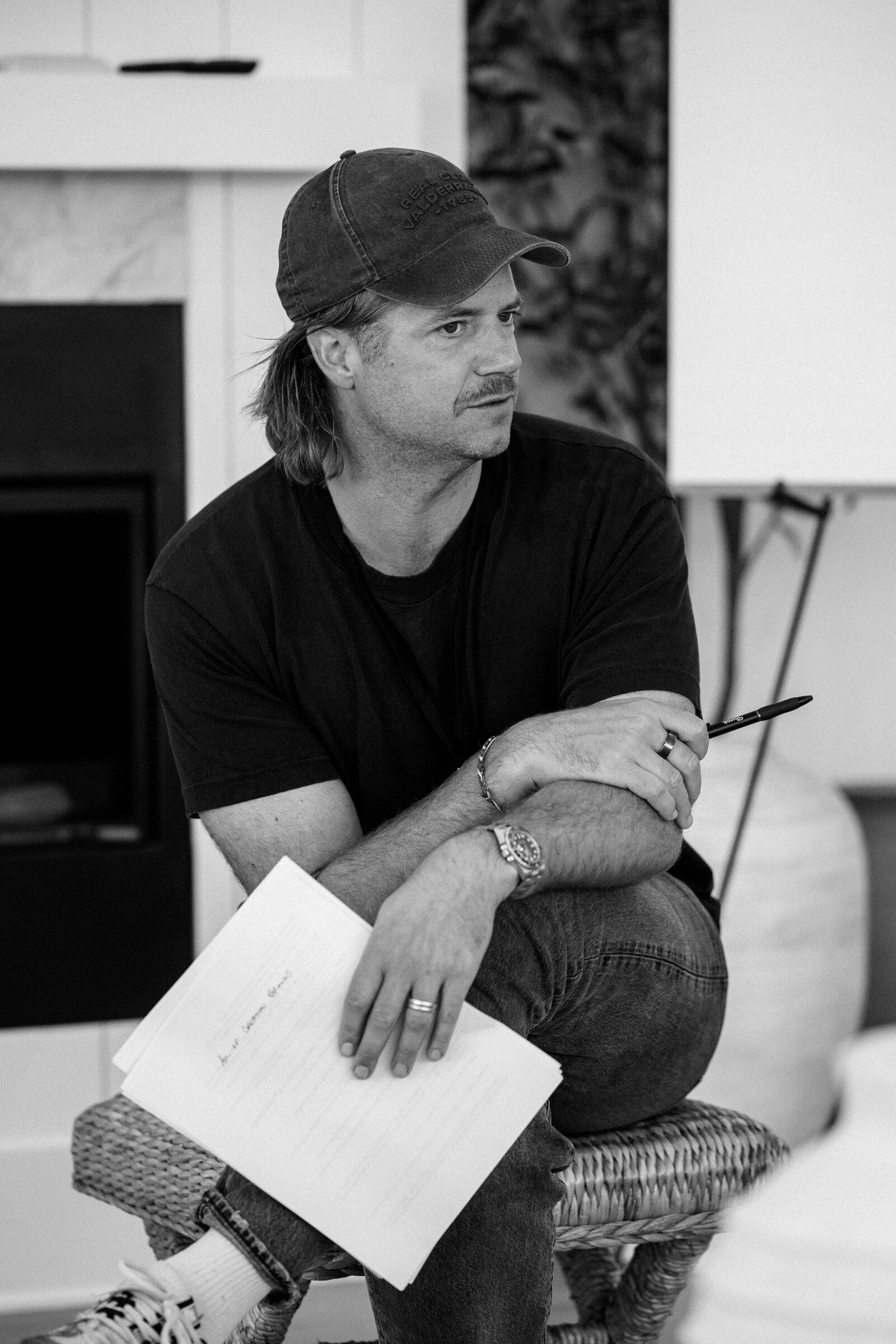 A member listening, notes in hand