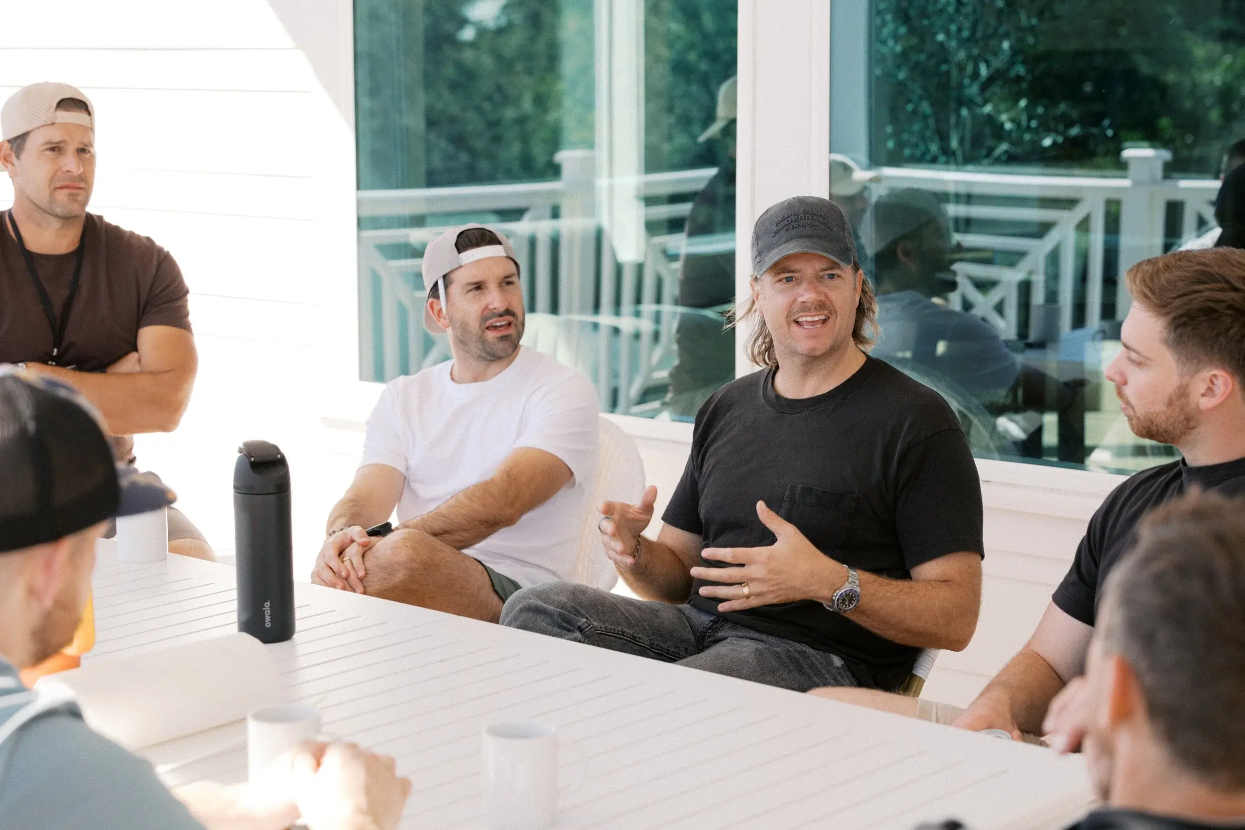 Members talking around a table