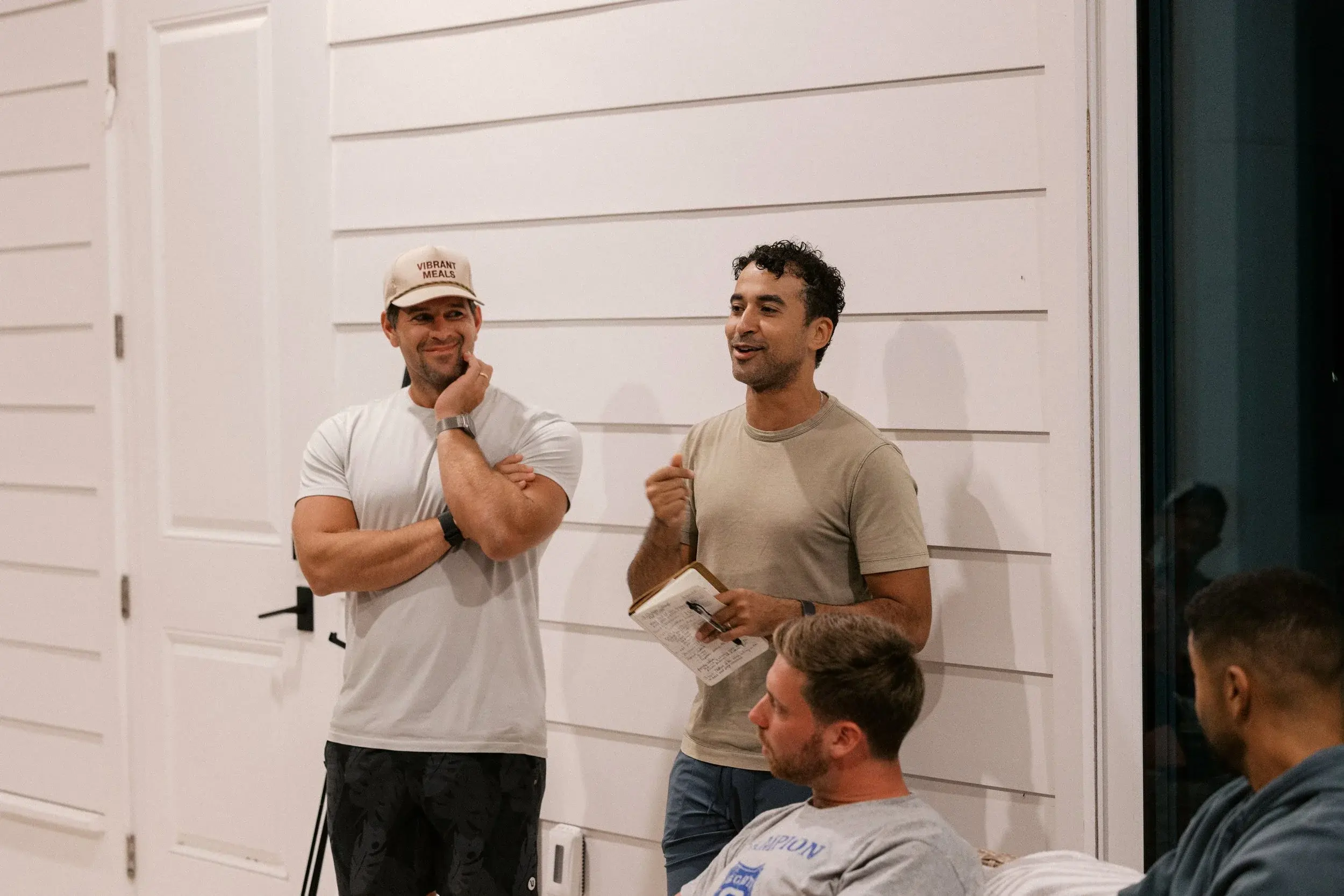 Two members sharing a laugh during a session